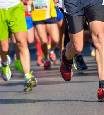 Lower limb photo of athletes running, used as a feature image for an article about Adelaide sports podiatry services.